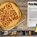 An edible QR code drawn on a pizza.